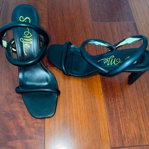 Classic black open toe heels flattering on feet